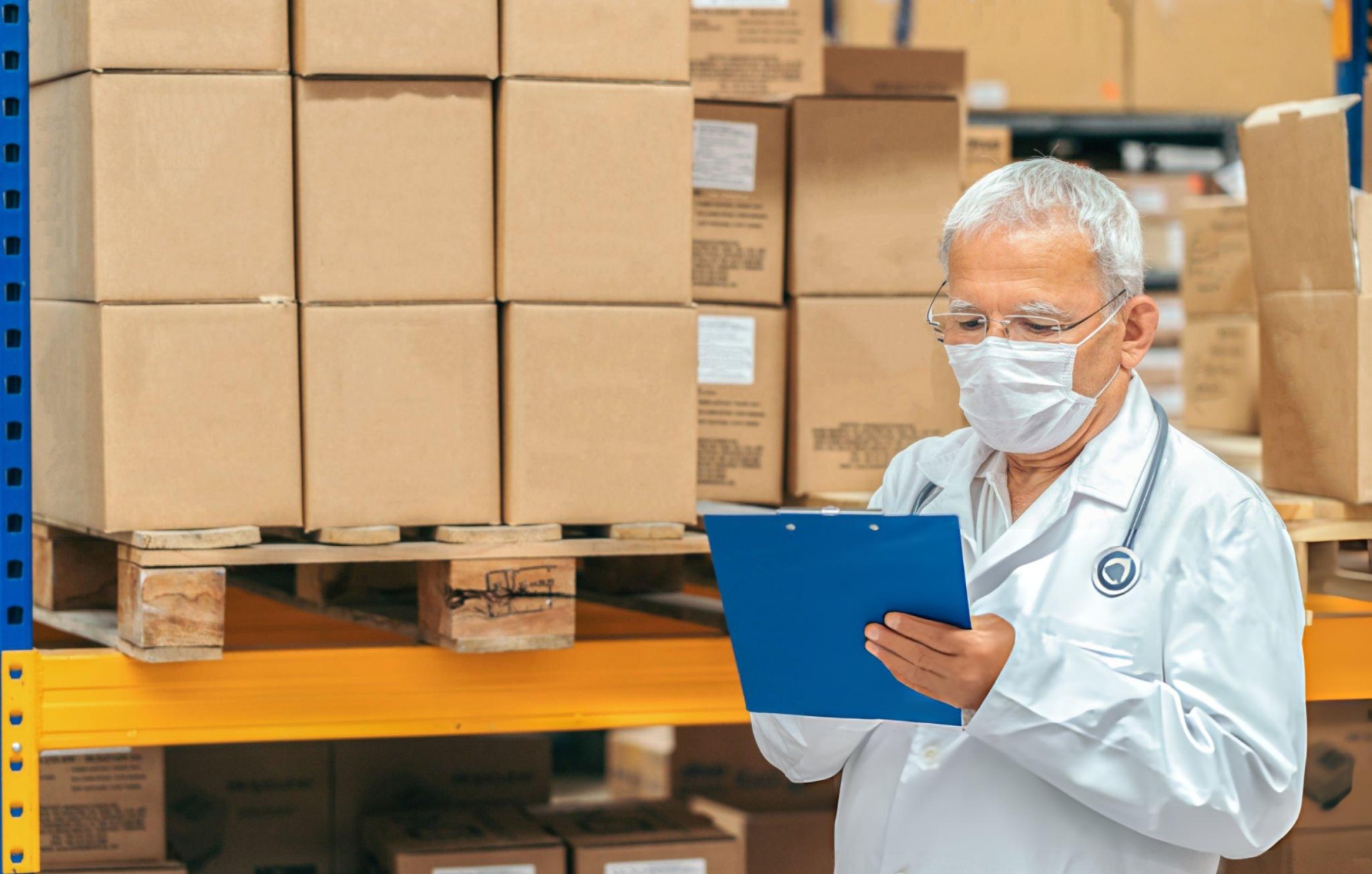 Healthcare professional auditing medical supply inventory in a warehouse